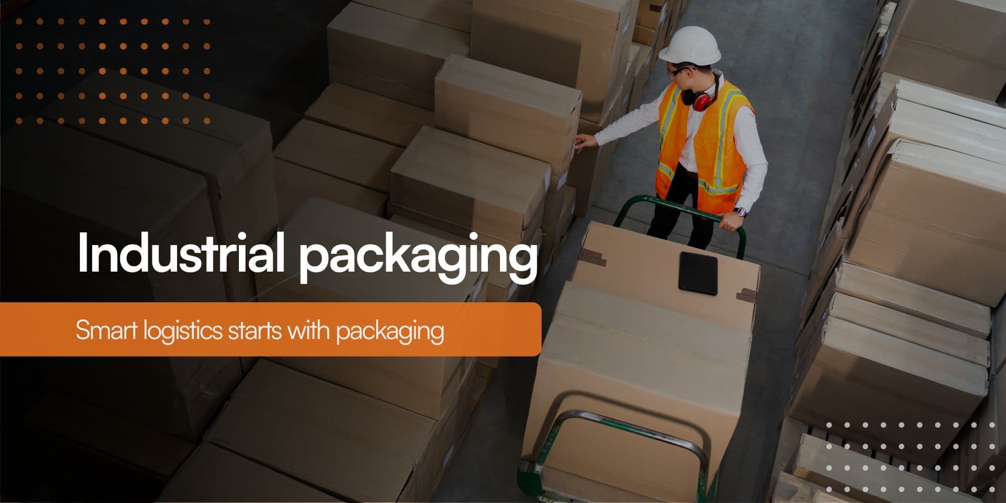 Warehouse worker lifting and moving cardboard boxes onto a pallet in a logistics area
