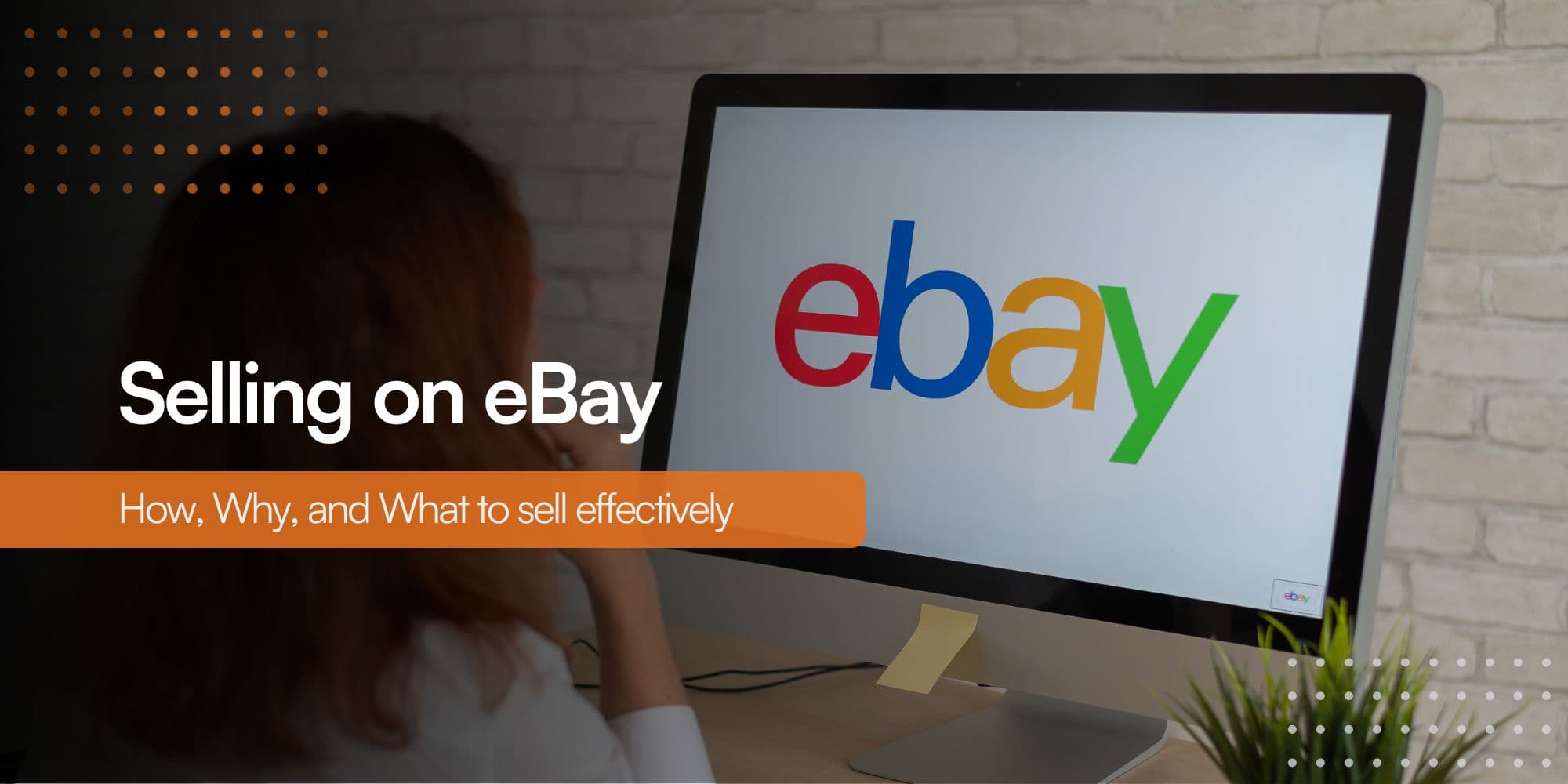 A person seen from behind, seated in front of a computer monitor, shopping on the eBay marketplace.